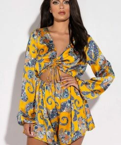 ADMIT IT LONG SLEEVE PRINTED ROMPER WITH CUT OUT