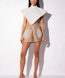LORIE PEARL EMBELLISHED FAUX LEATHER SHORTS 17 LORIE PEARL EMBELLISHED FAUX LEATHER SHORTS -FINESSE-shop lorie pearl embellished faux leather shorts beige 9 9
